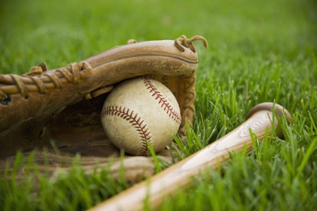 Baseball Equipment Laying on Grass